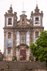 Portal of church Santo Ildefonso witth decorative Azulejo tiles in Porto