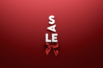 White sale sign with red ribbon on red background