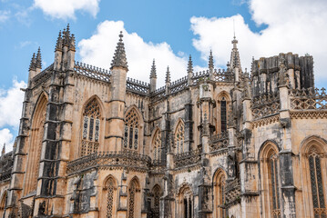 Picturesque facade of medieval Santa Maria da Vitoria monastery church in Batalha, a manueline gothic masterpiece, view on the southern facade