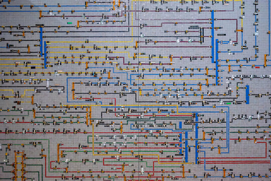 Intricate network diagram displaying multiple interconnected lines and elements on a grid of an electric city plan