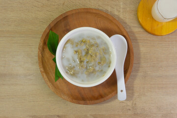 Mung Bean Porridge or Bubur Kacang Hijau, Indonesian dessert porridge of mung beans with coconut milk, pandan leaf and ginger. Served in bowl.