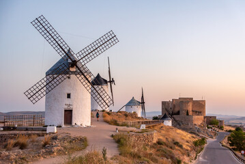 Iconic historic windmills in Consuegra at sunrise, Spain, known from Cervantes novel Don Quichotte