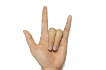 Female hand showing rock n roll sign or giving the devil horns gesture