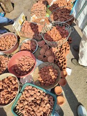 Diya's selling in the market for diwali occasion. People selling hand made diye (handmade candle or oil candle). Stock of dipawali diya's. Collection of diya or oil lamp. 
