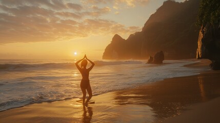 Back view of young woman doing yoga at beach during sunset