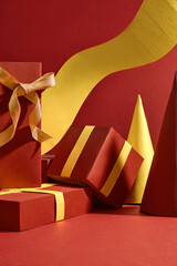 Frontal shot photo of Noel layout with luxury style. Some red gift boxes with yellow bow and pine...