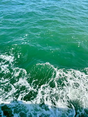 An amazing background of the azure water of the Venetian Grand Canal mixing with the snow-white foam left by the speed boat.