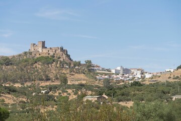 Obraz premium Panoramic view of the castle of Alburquerque or Luna castle on top of a hill.