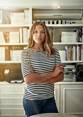 Woman, portrait and writer in home office, arms crossed and bookshelf for editing fiction. Female person, literature agent and proud of novel collection, confident and independent startup company