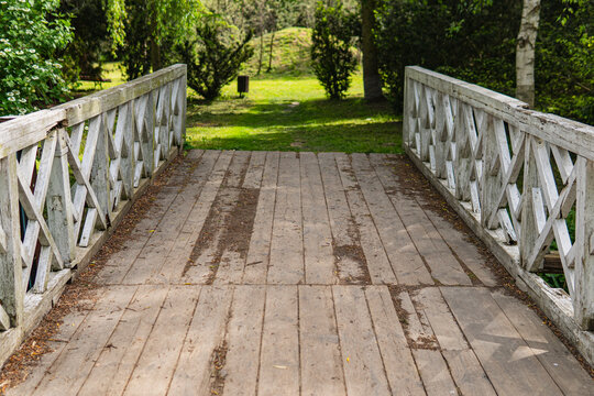Old wooden bridge with white painted railings