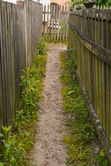 old wooden carved fence covered with green tarnish