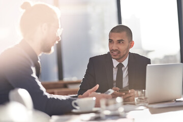 Business people, conversation and laptop with meeting, teamwork and collaboration of account management. Online, internet and diversity with planning, client relations and tech with office discussion