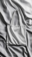 A minimalist tote bag mockup displays a clean design against a textured fabric backdrop