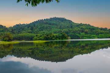 Mountains by the lake, landscape, pristine nature and the abundance of forest resources in rural areas, tropical countries, Asia.