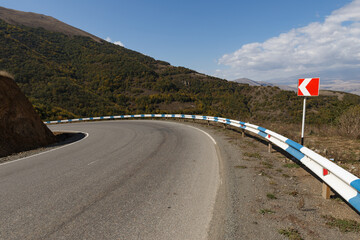 metal road fencing of barrier type on a mountain road. Road and traffic safety. Curve of the...