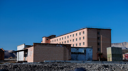 Exploring the abandoned Soviet mining town of Pyramiden in Svalbard on a clear sunny day