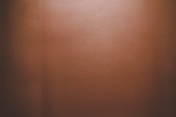 A perfectly flat, smooth brown wall background