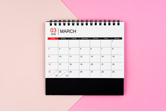 March 2025 desk calendar on pink background. Page of annual monthly calendar for your plan.