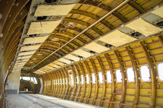 Airplane under heavy maintenance. Interior space of abandon aircraft. Photo of the inner structure of a decommissioned airline aircraft