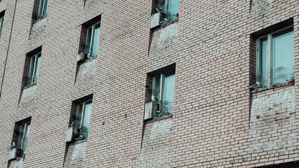 Abandoned building in Pyramiden, Svalbard showcases weathered brick and empty windows