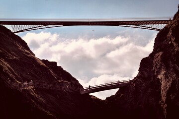 bridge over canyon rock beach
