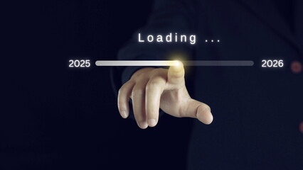 Businessman touching to downloading bar to change 2025 to 2026 year for change and preparation new...