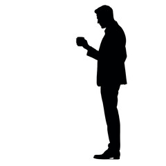 A businessman silhouette standing and drinking coffee, with one hand holding a coffee cup near his mouth