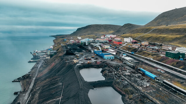 Barentsburg mining operations along the coast in Svalbard during cloudy weather