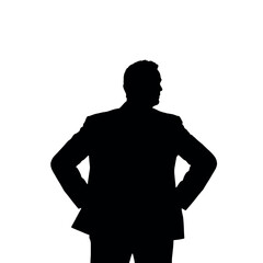 A businessman silhouette with hands on his hips, looking out as if surveying a business deal