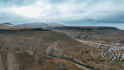 Aerial view of Longyearbyen in Svalbard with mountainous terrain and colorful buildings