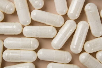 Vitamin capsules on a light background. Dietary supplements for health