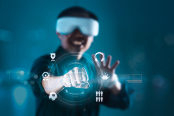 Futuristic Engagement: Man in VR Headset Pointing at Interactive Screen of Icons