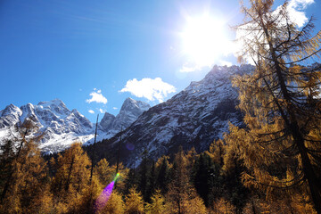 Perfect autumn and snowy mountains in Bipenggou, Sichuan, China