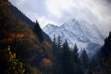 Perfect autumn and snowy mountains in Bipenggou, Sichuan, China