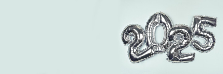 2025 Silver Balloon Numbers on blue background