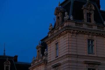 renaissance Ukraine medieval palace architecture town scape building old architecture corner facade in twilight night natural lighting with blue sky background