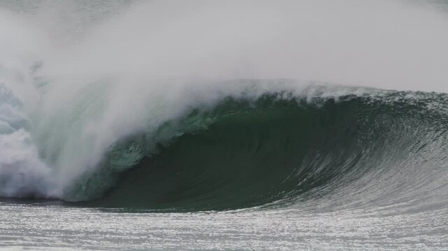 Stormy day in Sydney with slow motion waves crashing along the coast, turbulent seas and huge swells