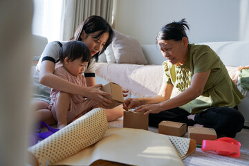 A young Asian family is preparing for their 2-year-old daughter's birthday party
