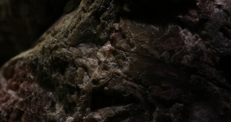 Close-up of Dark Rough Rock Surface with Natural Patterns