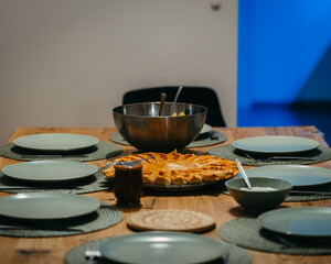 Skogafoss waterfall during sunrise with a person standing in yellow coat