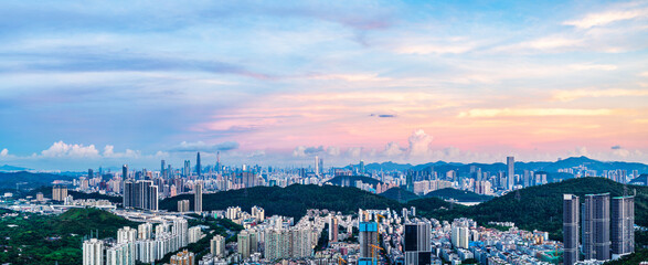 Panoramic view of city skyline and modern buildings in Shenzhen at dusk, China. Famous travel destinations in China.