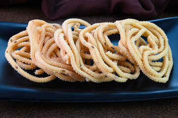 Murukku indian snack dish served in a plate.