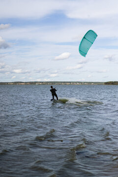 A mid adult man heads out for kitesurfing