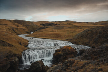 Hestava&eth;sfoss waterfall at sunrise in Iceland during winter