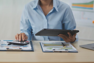 Fototapeta premium Business Documents, Auditor businesswoman checking searching document legal prepare paperwork or report for analysis TAX time,accountant Documents data contract partner deal in workplace office