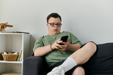 Engaging in a moment of relaxation while checking his phone.