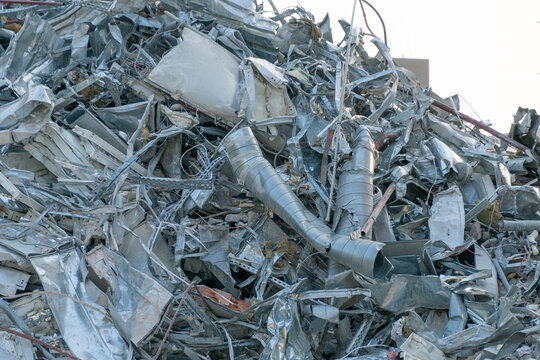 The wreckage of a demolished building. A pile of construction waste on a construction site. Concrete, metal.
