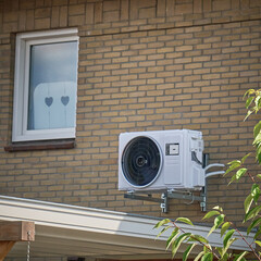 Close up on heat pump installation on Dutch house