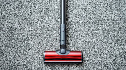 A sleek, modern vacuum cleaner head rests on a textured carpet, showcasing its design and functionality.
