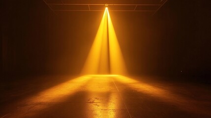 A warm, golden spotlight shines in a dark room, casting a focused beam that creates a radiant, glowing pool on the floor.